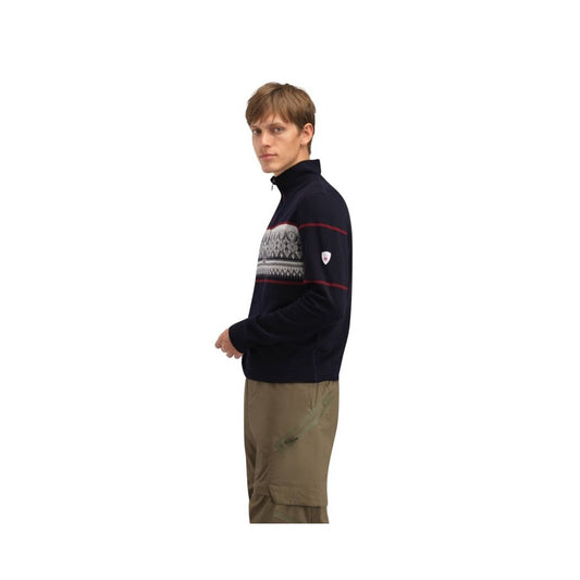 Side view of the Dale Of Norway Moritz Masc Basic Sweater-SAMPLE in NavyWhtRaspberr on a model wearing khaki pants against a white background.