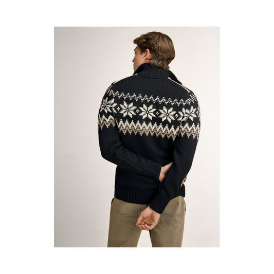 Back view of the Dale Of Norway Myking Masc Sweater-SAMPLE in BlkBrwnOffWht on a model against a light background.