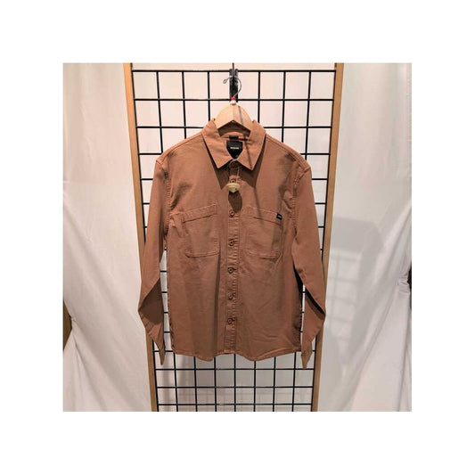 Front view of the Prana Mens Rock Ridge Overshirt-SAMPLE in Tawny hanging on a grid display with a white backdrop.