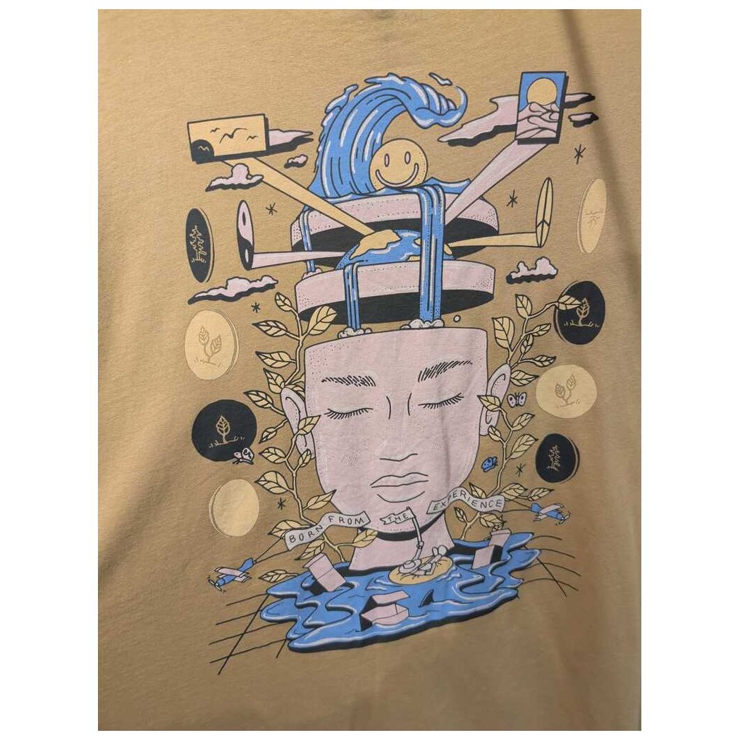 Front view of the Prana Womens Everyday Graphic Oversized Tee-SAMPLE in Dijon Vacation showing the whimsical graphic design on a tan background.