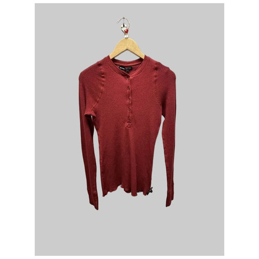 Front view of the Prana Womens Touchstone Henley-SAMPLE in RetrograHeather hanging on a wooden hanger against a gray background.