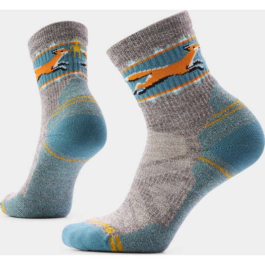 Side view of the Smartwool Women's Hike Fox Meadow Mid Crew Socks in Nightfall Blue showing the fox graphic and reinforced heel against a white background.