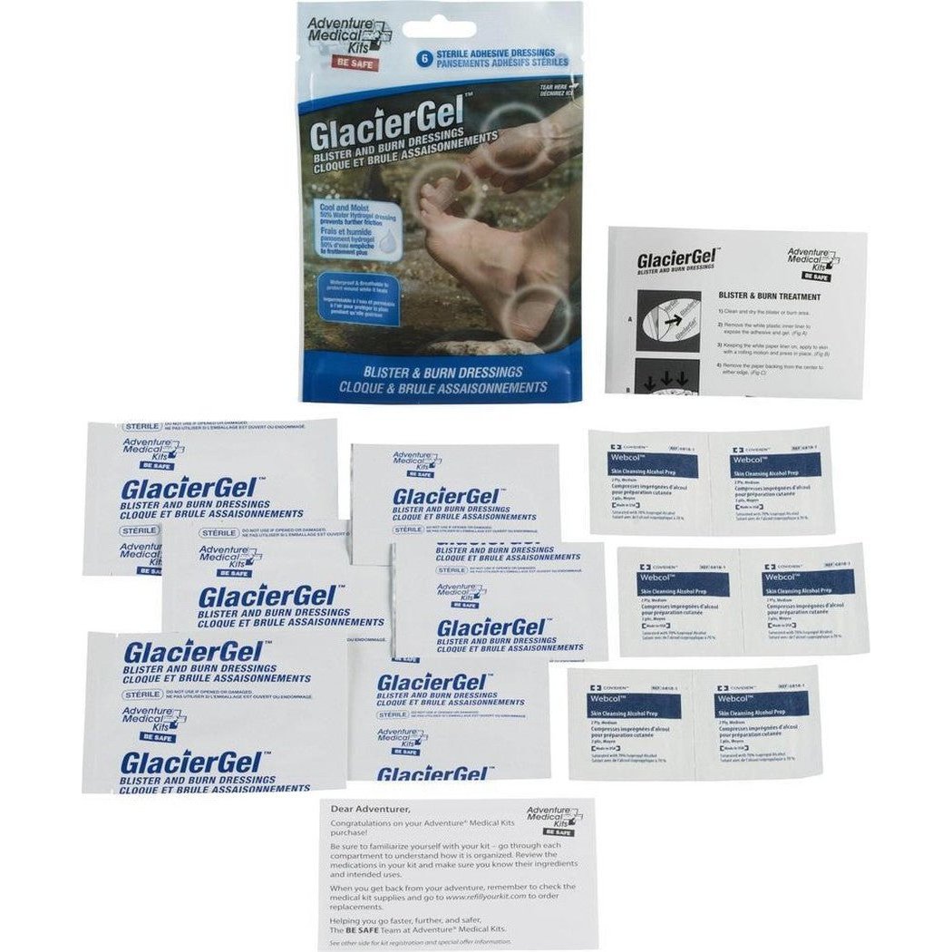 A package of Adventure Medical Kits GlacierGel Blister and Burn Dressing with multiple individual packets laid out below it.