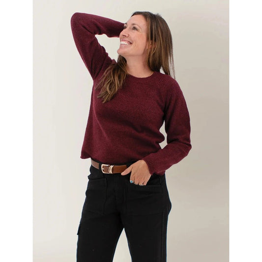 Model wearing the Aventura Womens Mable Sweater in Port Royale with one hand in pocket against a plain background.