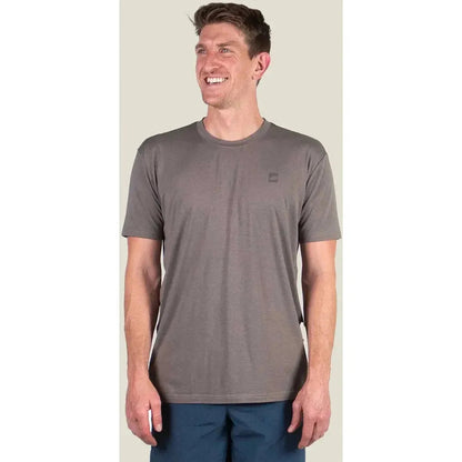 A front view of the Belong Designs Men's Core Traverse Tek Tee in Granite on a model against a light background.