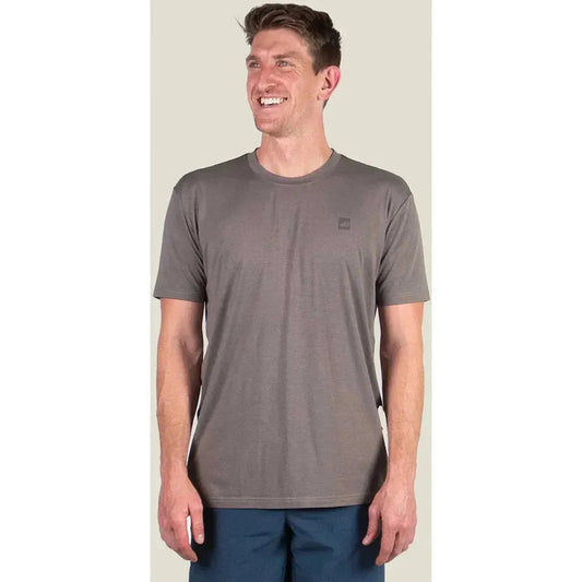 A front view of the Belong Designs Men's Core Traverse Tek Tee in Granite on a model against a light background.