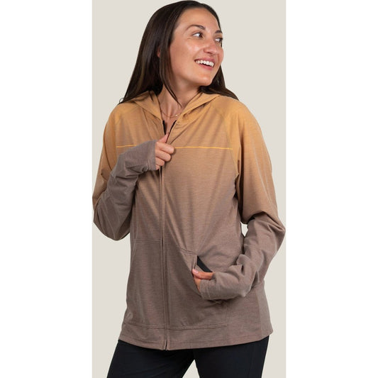 Front view of the Belong Designs Women's Core Traverse Tek Hoodie ZIP in Lone Peak Amber with a model wearing it against a light background.
