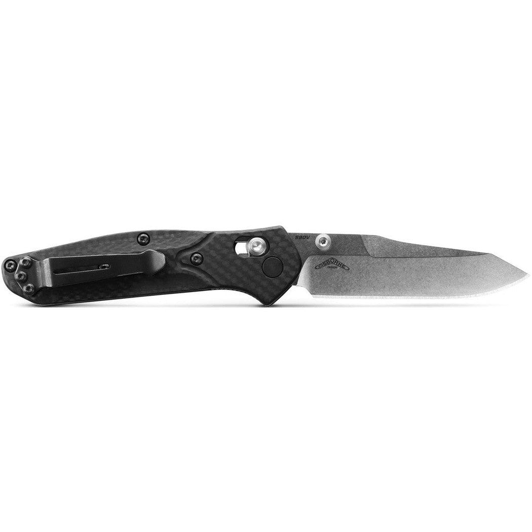Side view of the Benchmade 945 Mini Osborne knife with a black handle and silver blade against a white background.