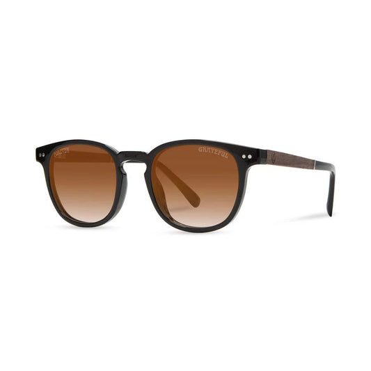 Front view of the Camp Eyewear Topo: Grateful Dead Stealie Edition sunglasses in Desert with Grateful Dead logo engraved on the frame against a white background.