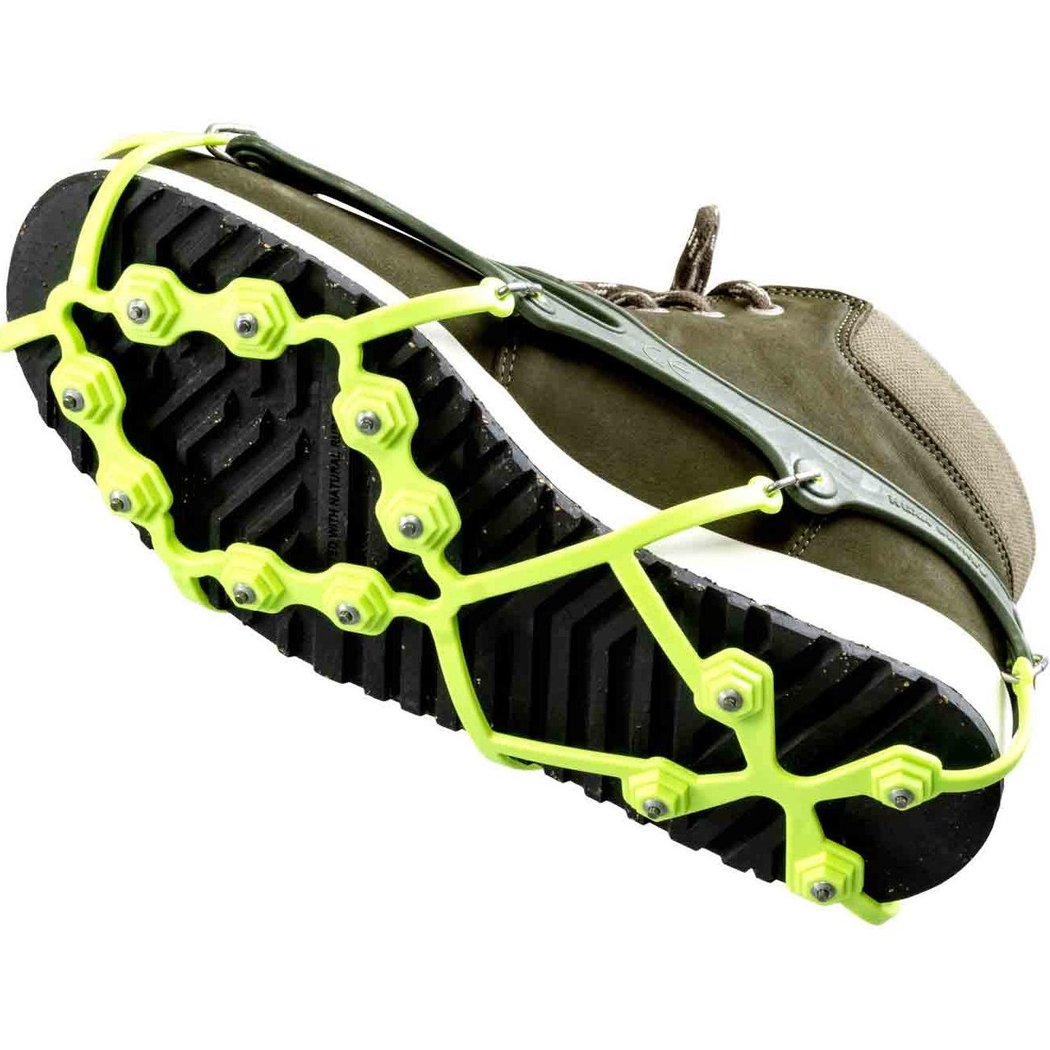 Close-up of the CAMP Spikes Hexa attached to a shoe showing the bright green spikes and black outsole.