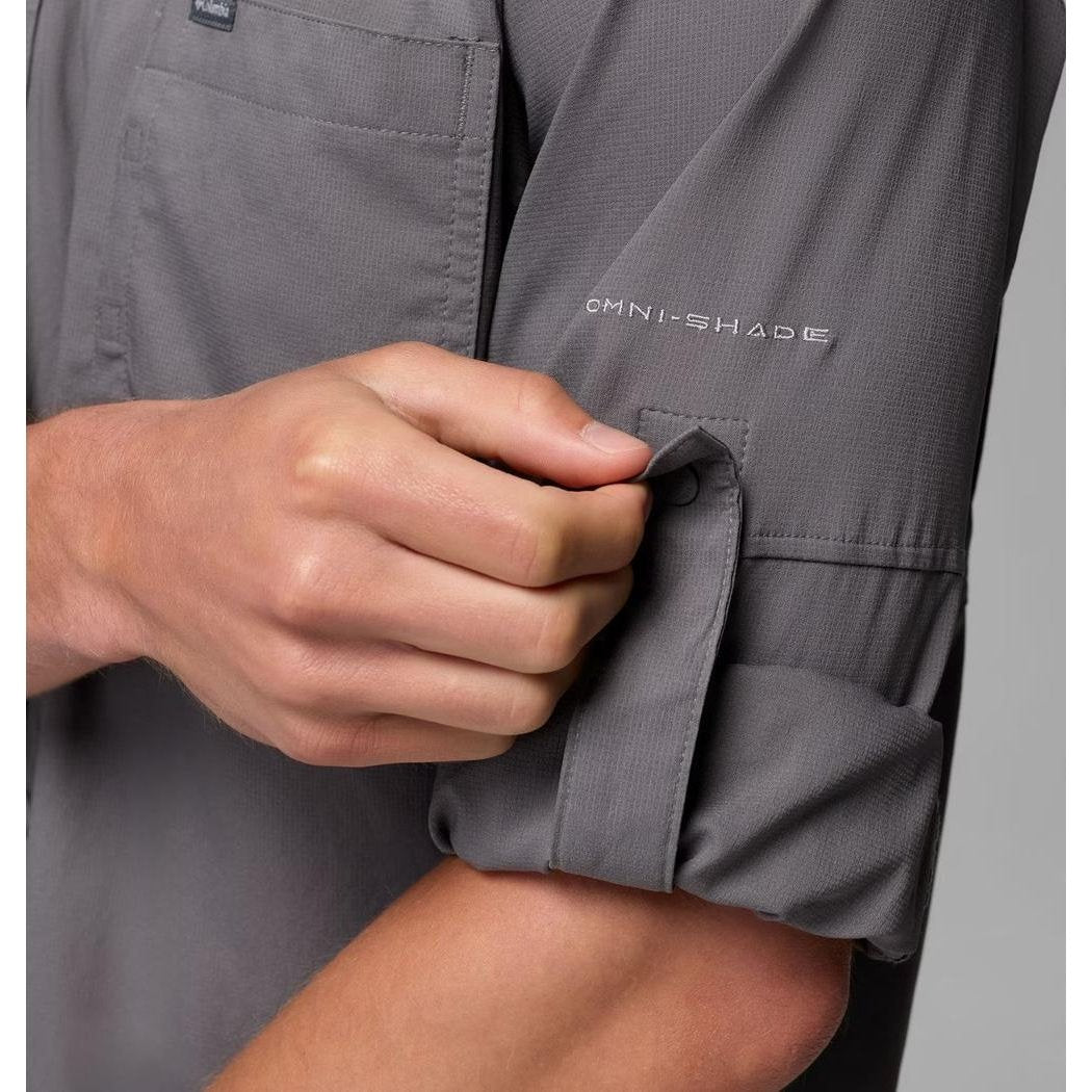 A close-up of the Columbia Sportswear Men's Silver Ridge Utility II LS Shirt in City Grey, showing a hand rolling up the sleeve with the "Omni - Shade" logo visible on the upper arm.