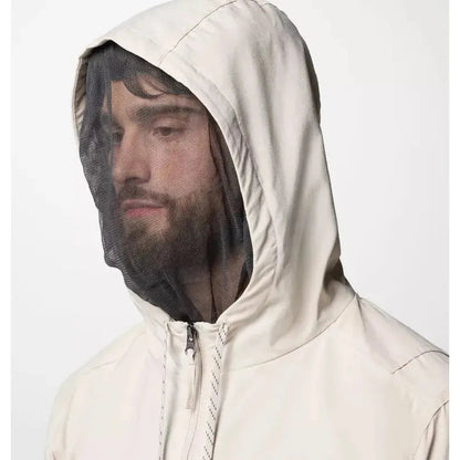 A front view of the Columbia Sportswear Men's Skien Valley Hooded Long Sleeve Shirt in Dark Stone with a mesh face covering and white background.