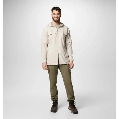 A front view of the Columbia Sportswear Men's Skien Valley Hooded Long Sleeve Shirt in Dark Stone on a model against a light gray background.