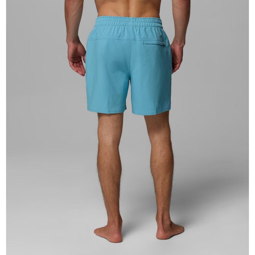 Back view of the Columbia Sportswear Men's Terminal Roamer Stretch Short in Vintage Blue on a barefoot model against a gray background.