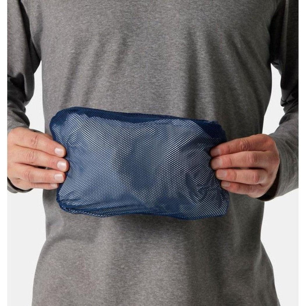 A man in a gray shirt holds a Collegiate Navy Columbia Watertight II Jacket against his torso, showing the mesh pocket and front view.