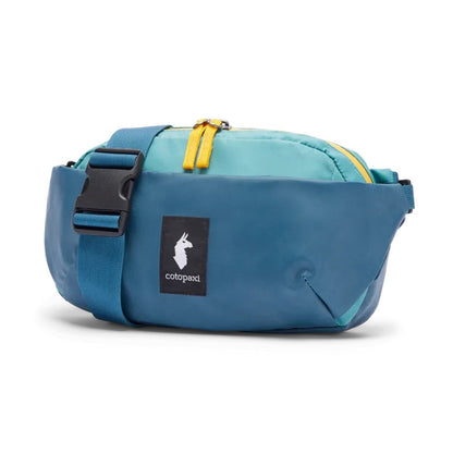 A front view of the Cotopaxi Coso 2L Hip Pack in Abyss/Coastal color with a black buckle and yellow zipper against a white background.