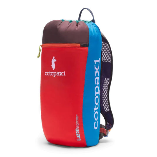 Side view of the Cotopaxi Luzon 24L Daypack Del Dia with red, blue and charcoal sections against a white background.