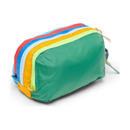 Front view of the Cotopaxi Nido Accessory Bag - Del Día in Del Día showing its colorful layered zippers against a white background.
