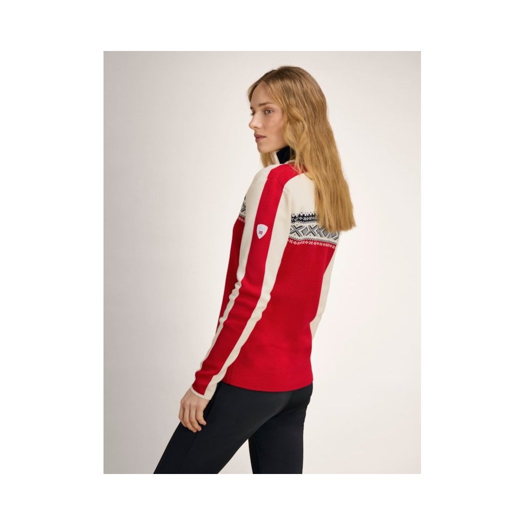 Side view of the Dale Of Norway Dystingen Fem Sweater-SAMPLE in RaspOffWhtNavy showing the patterned shoulder design on a model against a light background.