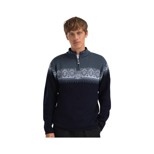 A front view of the Dale Of Norway Moritz Masc Sweater-SAMPLE in MarineSteelIce with a zip neck and patterned chest panel, worn by a model against a white background.