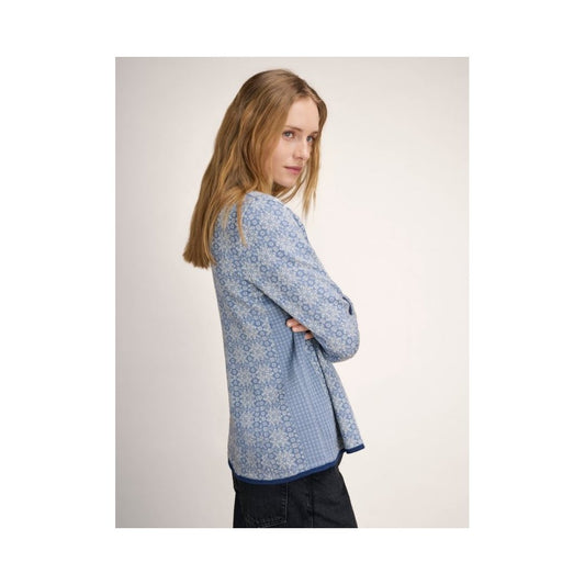 Side view of the Dale Of Norway Othelie Fem Jacket-SAMPLE in BluShadowOffWht with a model wearing it against a plain background.
