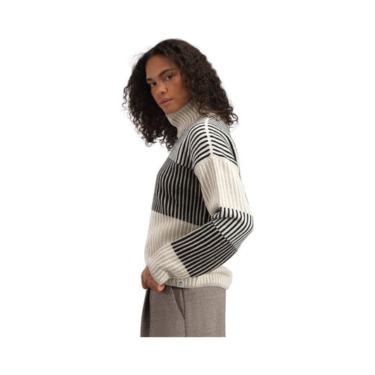 Side view of the Dale Of Norway Skarstind Fem Sweater-SAMPLE in OffWhiteSand showing the turtleneck and striped pattern against a white background.