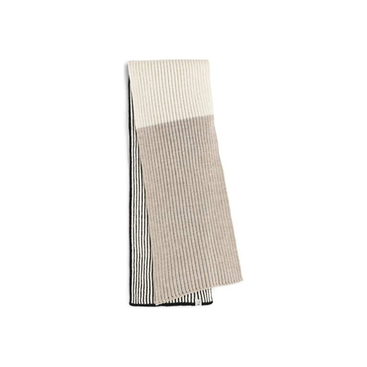 A folded Dale Of Norway Skarstind Scarf-SAMPLE with black, off-white, and sand melange sections lies against a white background.