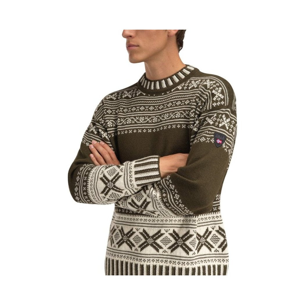 A man in a side view wears the Dale Of Norway Torridal Masc Sweater-SAMPLE with a white background.