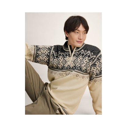 A model wearing the Dale Of Norway Vail Masc Sweater-SAMPLE in OffWhtCoffeeSnd, shown from a side angle against a plain background.