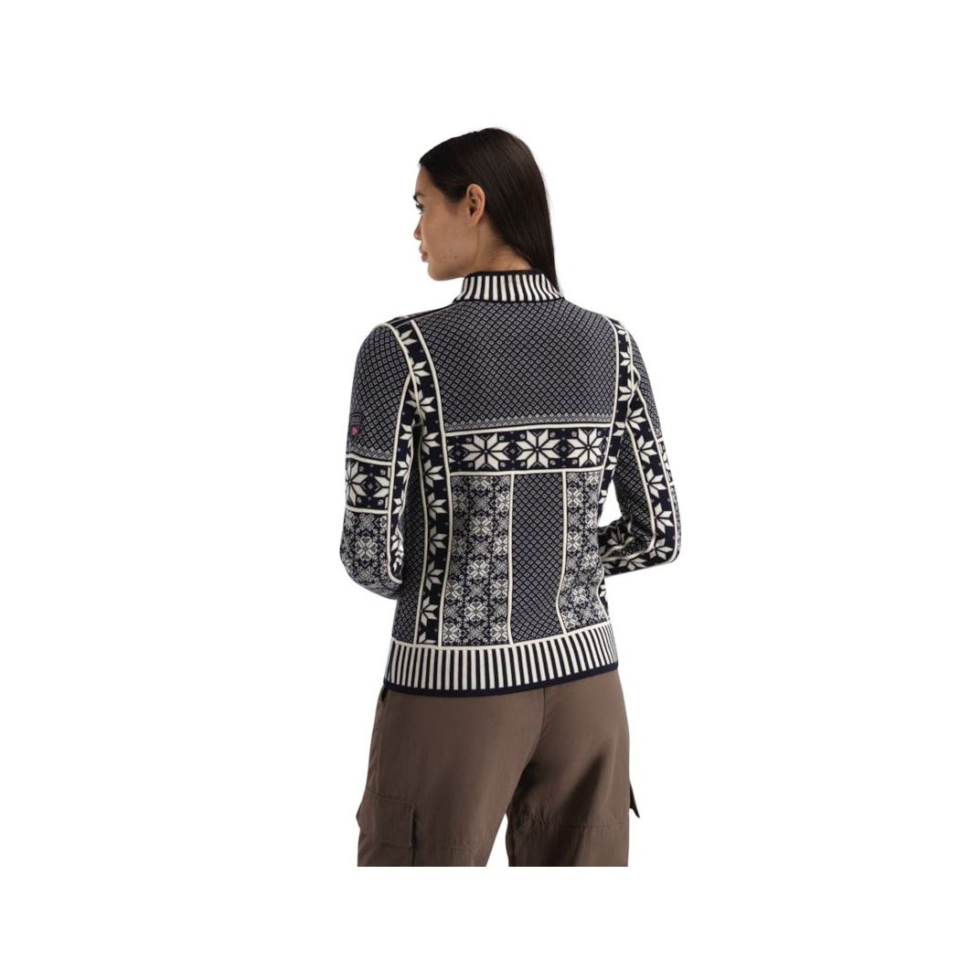 Back view of the Dale Of Norway Vardåsen Fem. Sweater-SAMPLE showing the patterned design on a model wearing brown pants against a white background.