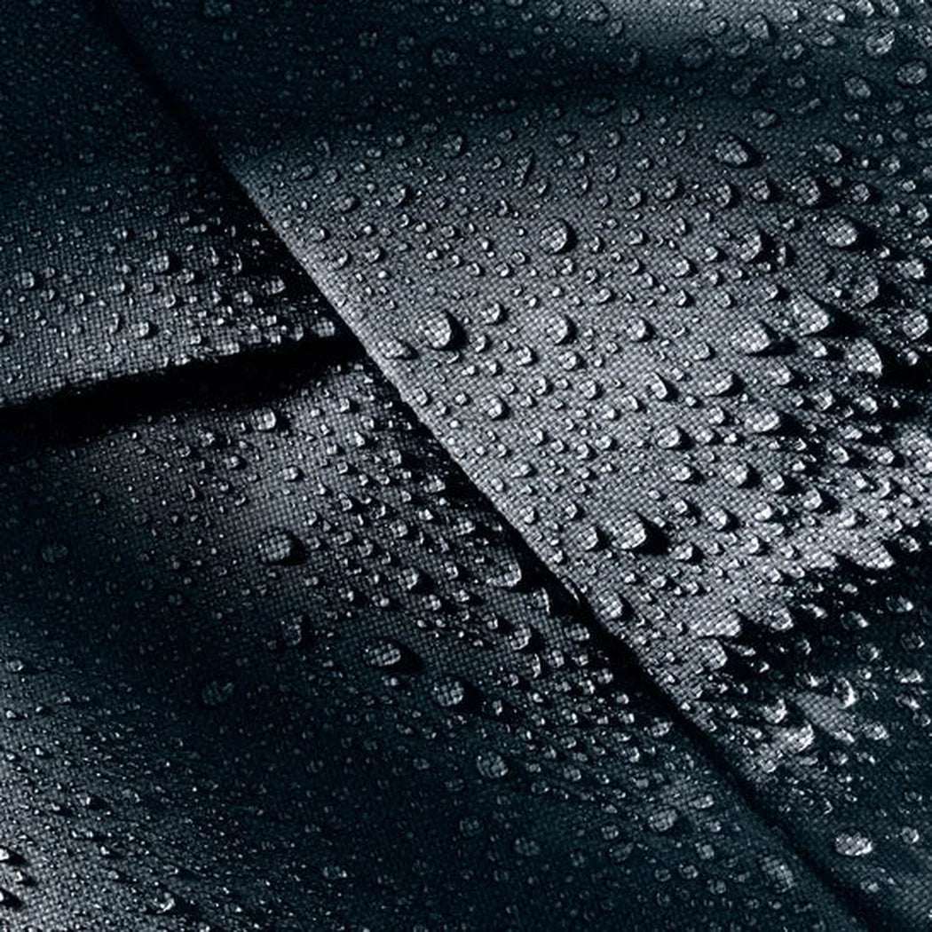 The Deuter Duffel Pro Movo 60 in Black shows water droplets on its surface from a top-down angle.