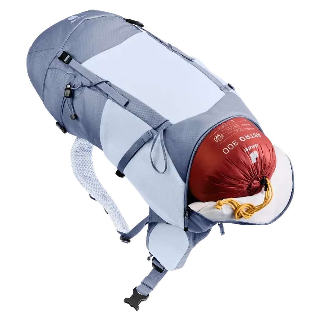 Side view of the Deuter Futura 30 SL backpack in Polar Bluejay showing the front compression strap and a red sleeping bag against a white background.