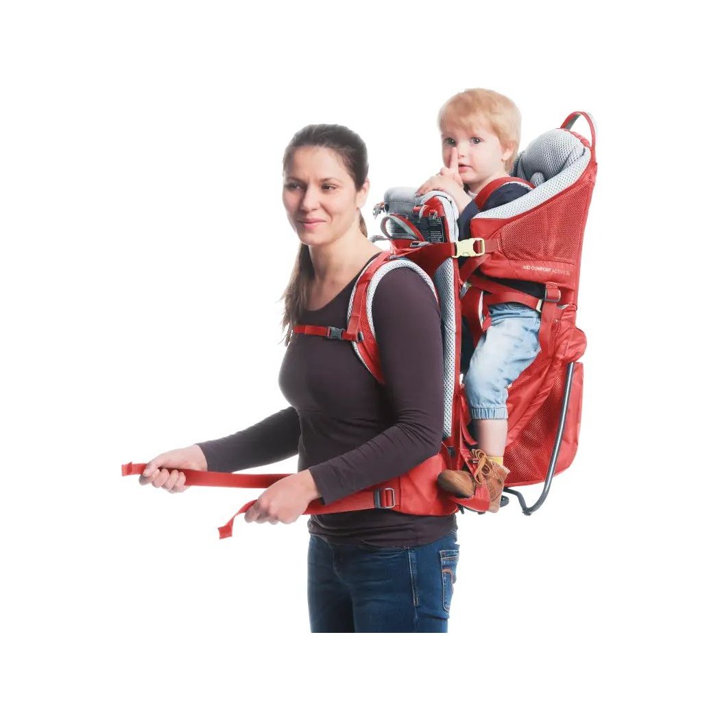Front view of the Deuter Kid Comfort Active SL in Currant with a child seated inside against a white background.
