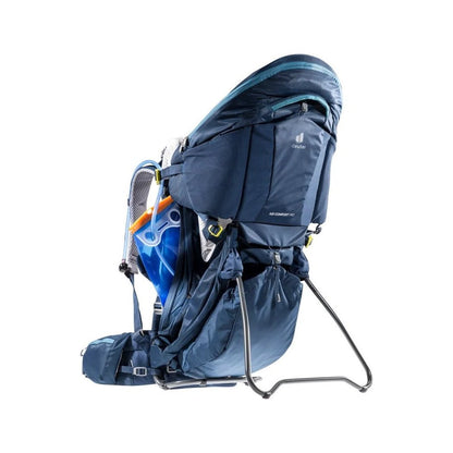 Side view of the Deuter Kid Comfort Pro in Midnight showing the frame and blue hydration reservoir against a white background.