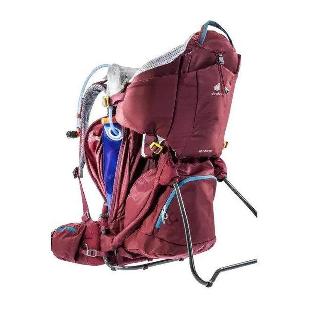 Side view of the Deuter Kid Comfort in Maroon showing the hydration tube and white background.