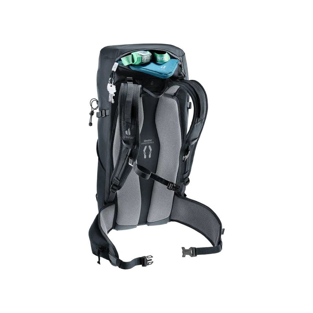 Back view of the Deuter Telatie 26 in Baltic Nightblu showing the padded back panel and top compartment with items inside.