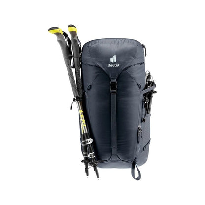 Front view of the Deuter Trail 30 in Black Shale with trekking poles attached against a white background.