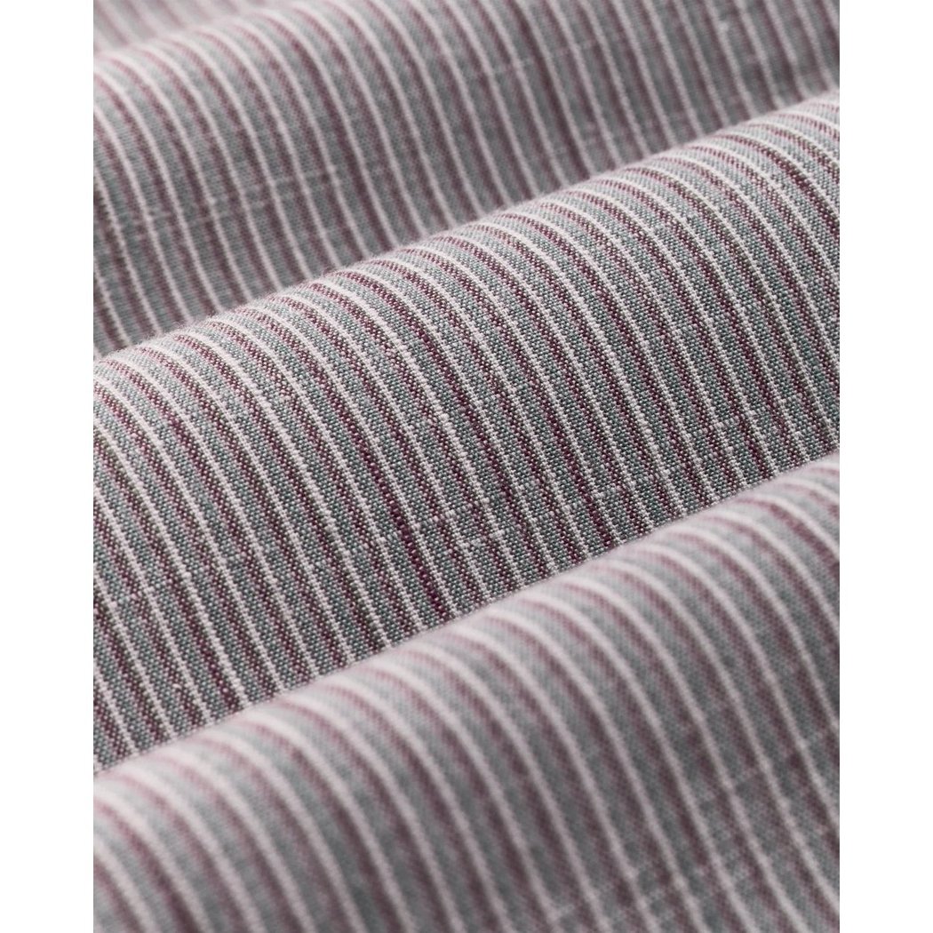 Close-up of the Filson Men's Chambray Button-Down Shirt in Cascade PLaid showing its striped fabric texture.