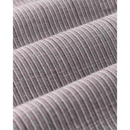 Close-up of the Filson Men's Chambray Button-Down Shirt in Cascade PLaid showing its striped fabric texture.