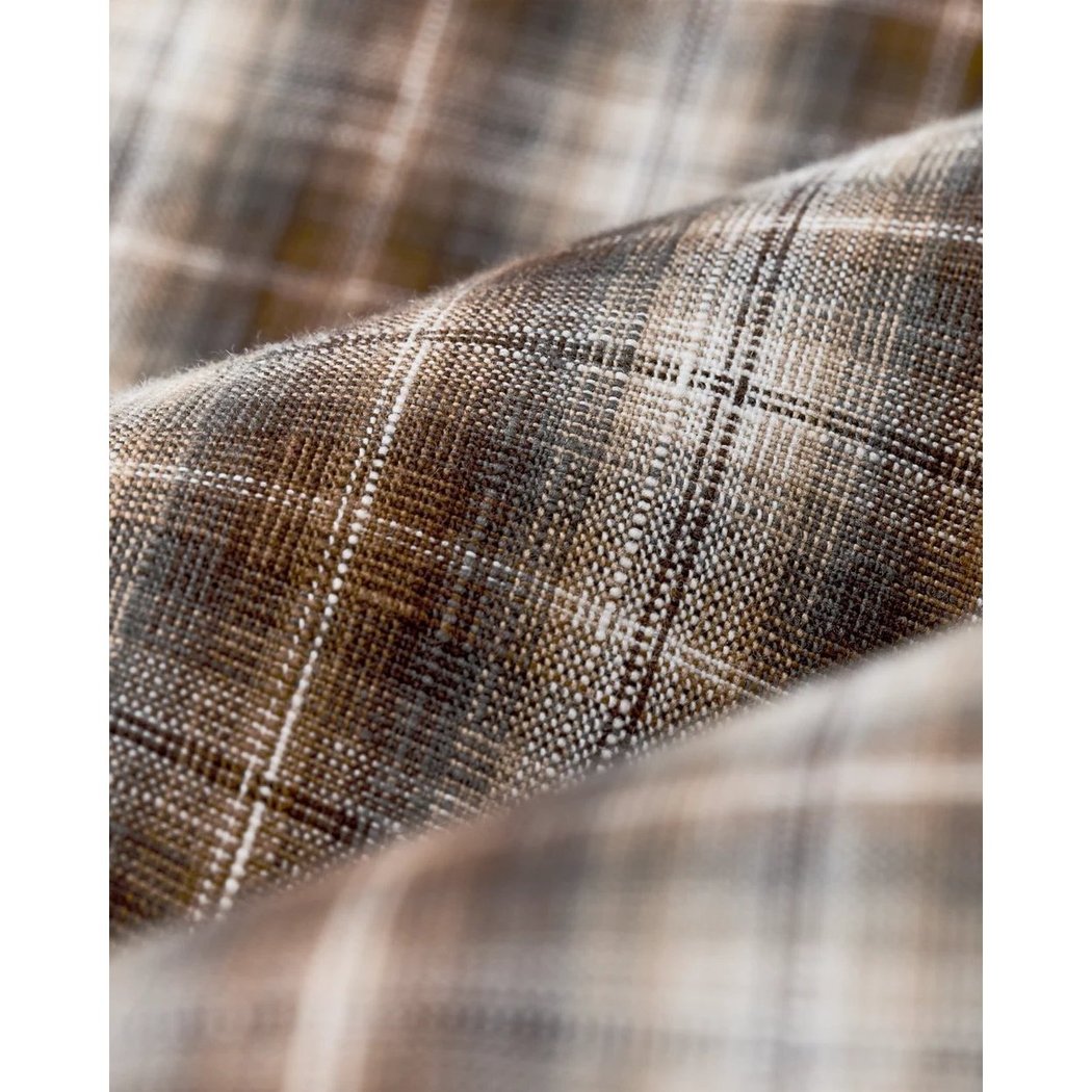 Close-up of the Filson Men's Chambray Button-Down Shirt in Cascade PLaid showing its plaid pattern and fabric texture.