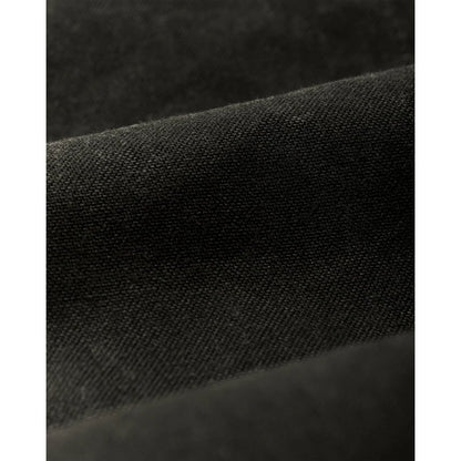 Close-up of the Filson Men's Short Lined Cruiser in Beluga showing its textured fabric and folded design.