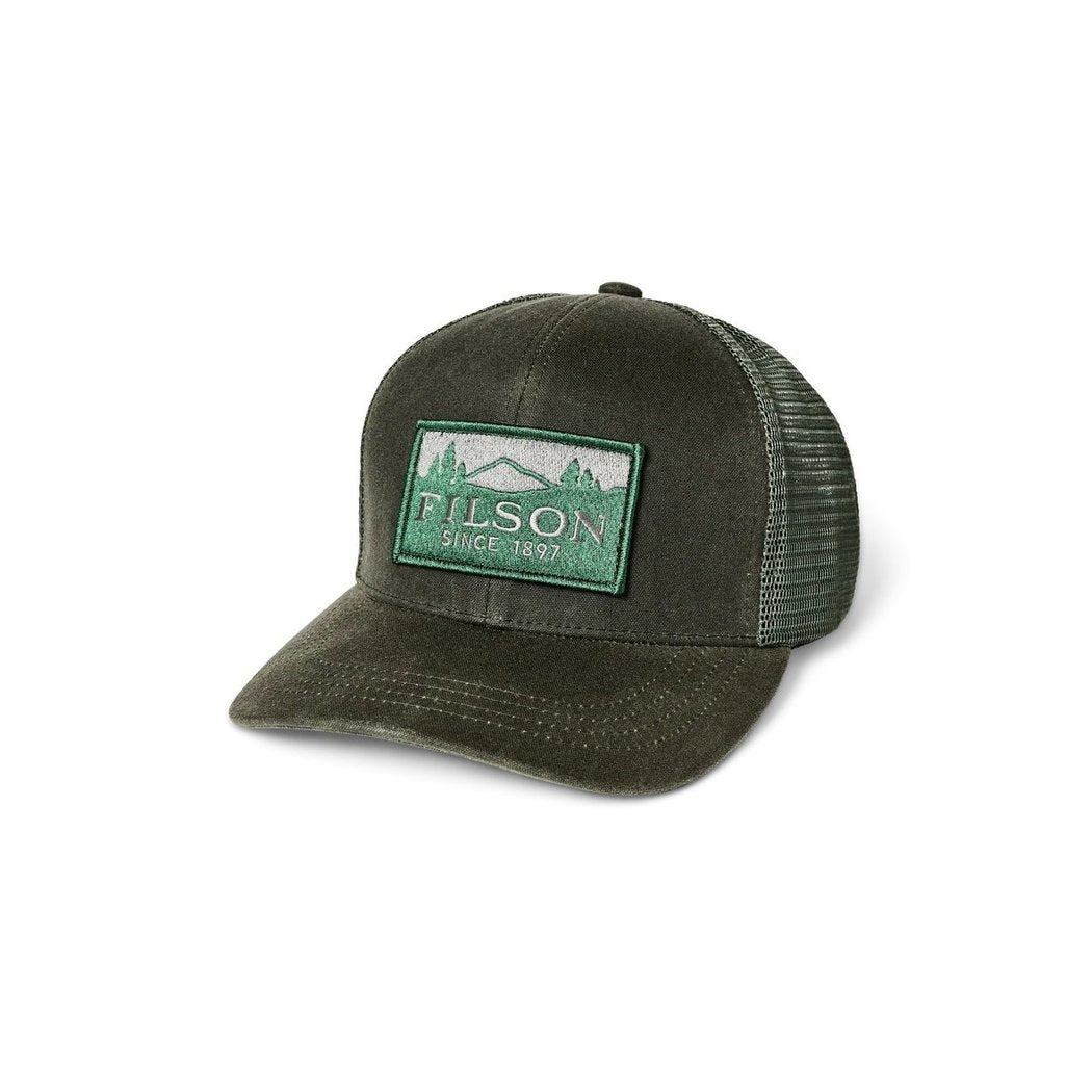 Front view of the Filson Scenic Waxed Logger Mesh Cap in Otter Green with a green embroidered patch on a white background.