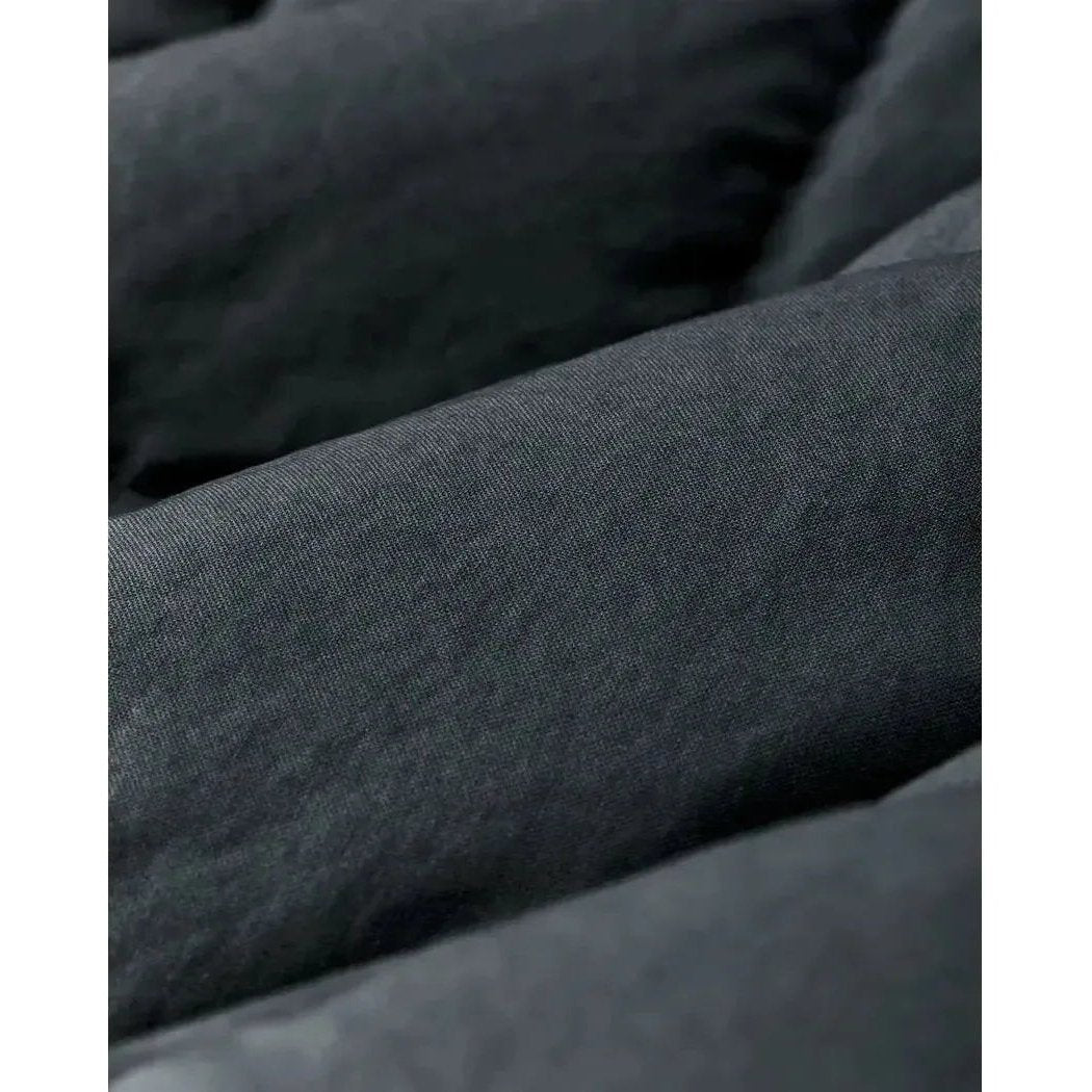 Close-up of the Filson W's Heritage Cotton Down Jacket in Bluefin showing the quilted design and fabric texture.