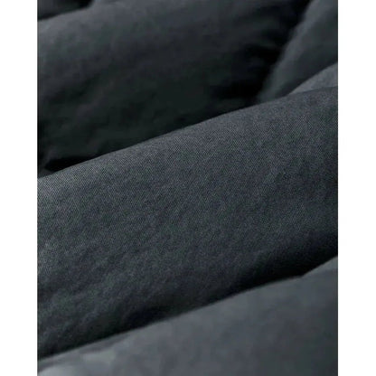 Close-up of the Filson W's Heritage Cotton Down Jacket in Bluefin showing the quilted design and fabric texture.