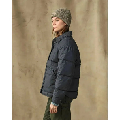 Side view of the Filson W's Heritage Cotton Down Jacket in Bluefin showing the model wearing it against a neutral background.