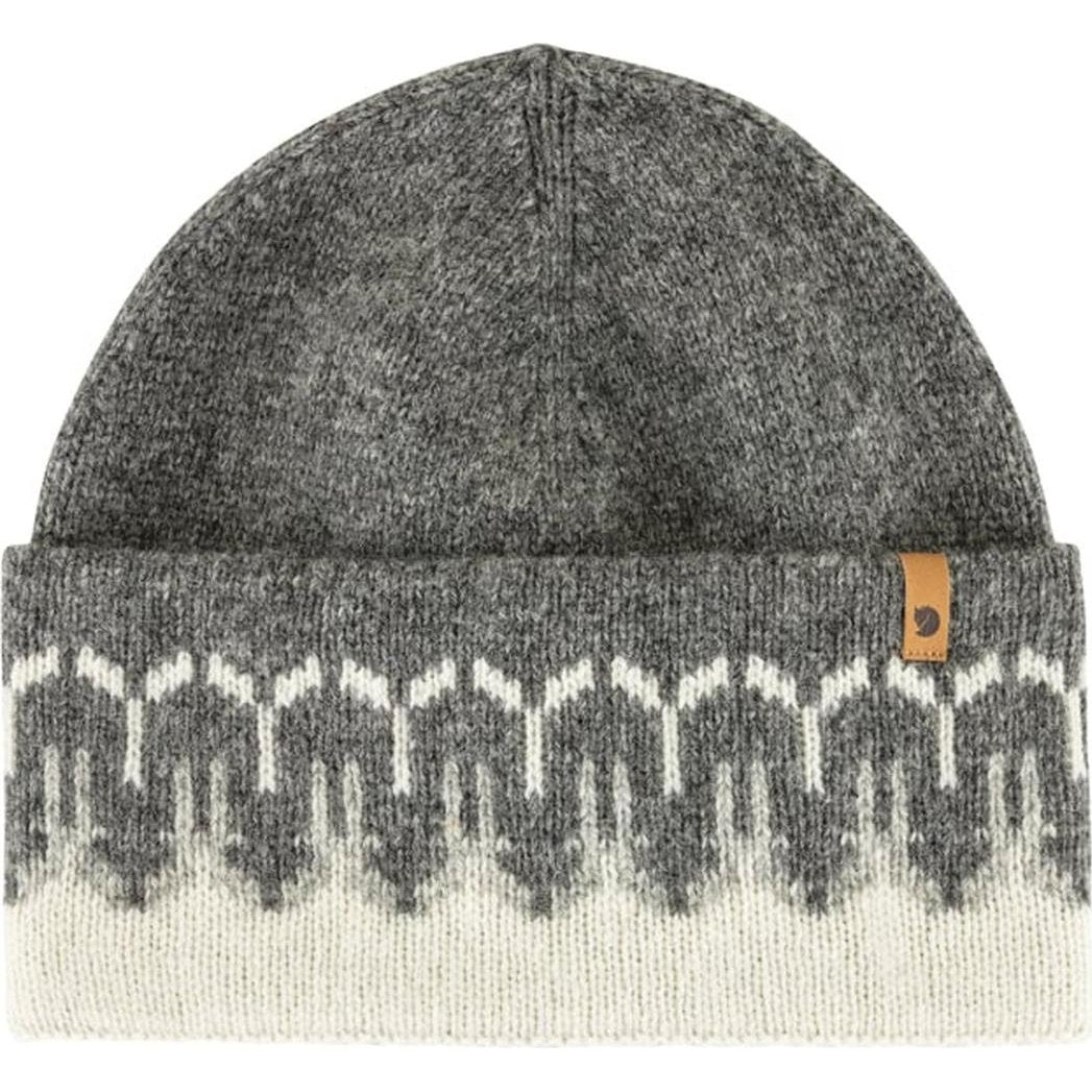 A front view of the Fjallraven Övik Path Knit Beanie in Chalk White Grey showing the patterned cuff and a small leather tag on the side.