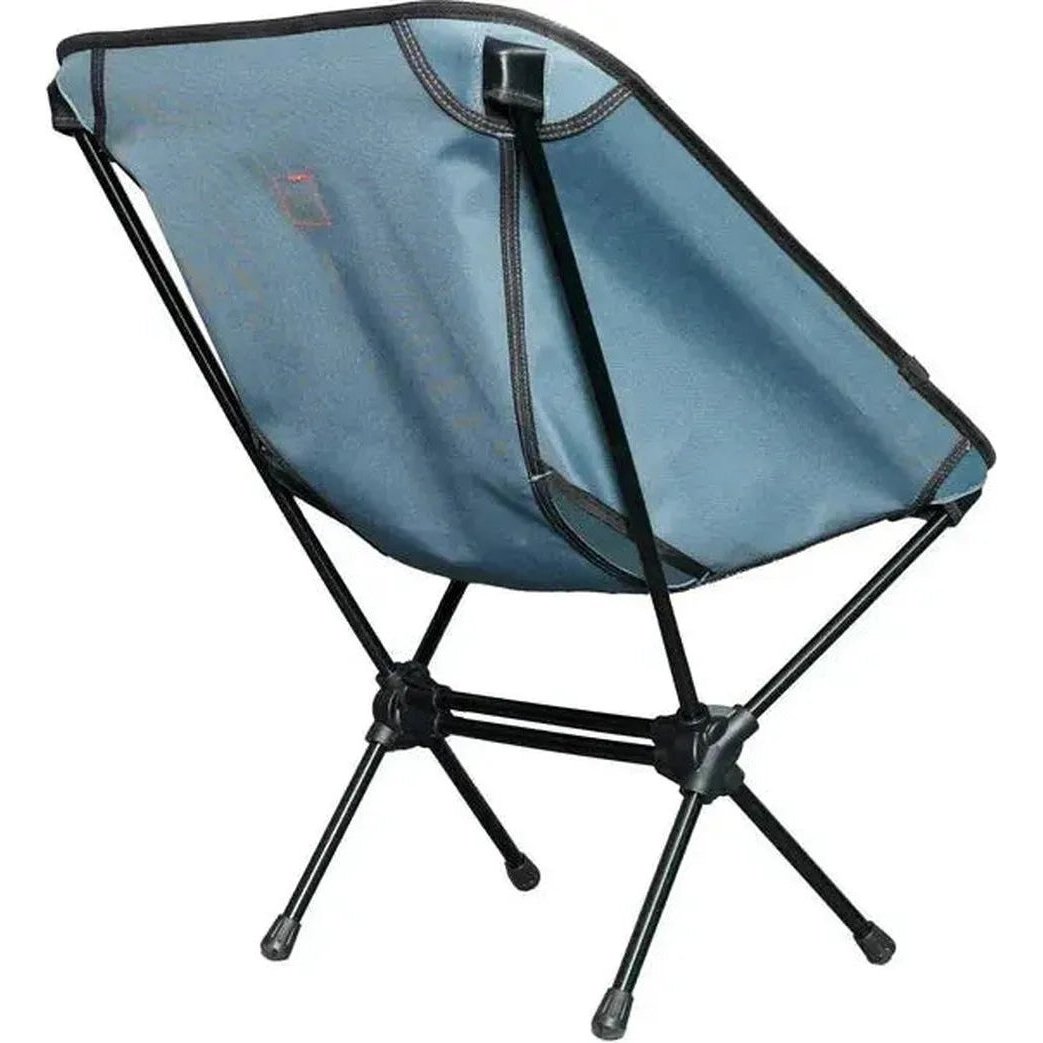 A side view of the Grand Trunk Caddis HD Chair in Storm Blue showing its foldable frame and black legs against a white background.
