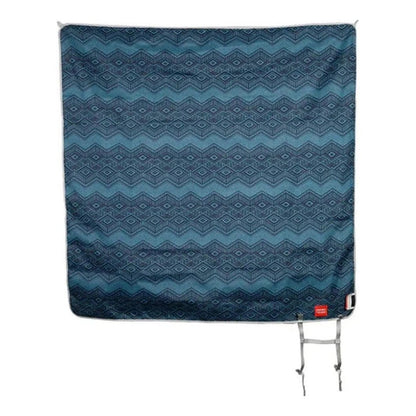 A top-down view of the Grand Trunk Meadow Mat in Horizon color showing its geometric pattern and metal tie-downs.