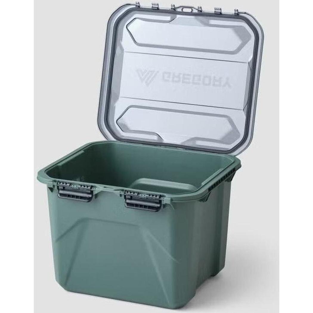 A top-down view of the Nomad Green Gregory Alpaca Camp Box 50L with its lid open, showing the latches and interior.