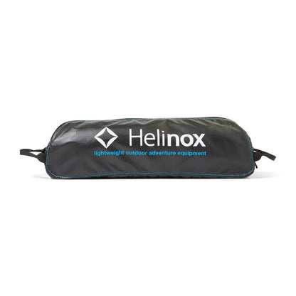 A black Helinox Table One Hard Top bag with blue accents and white text sits on a white background.